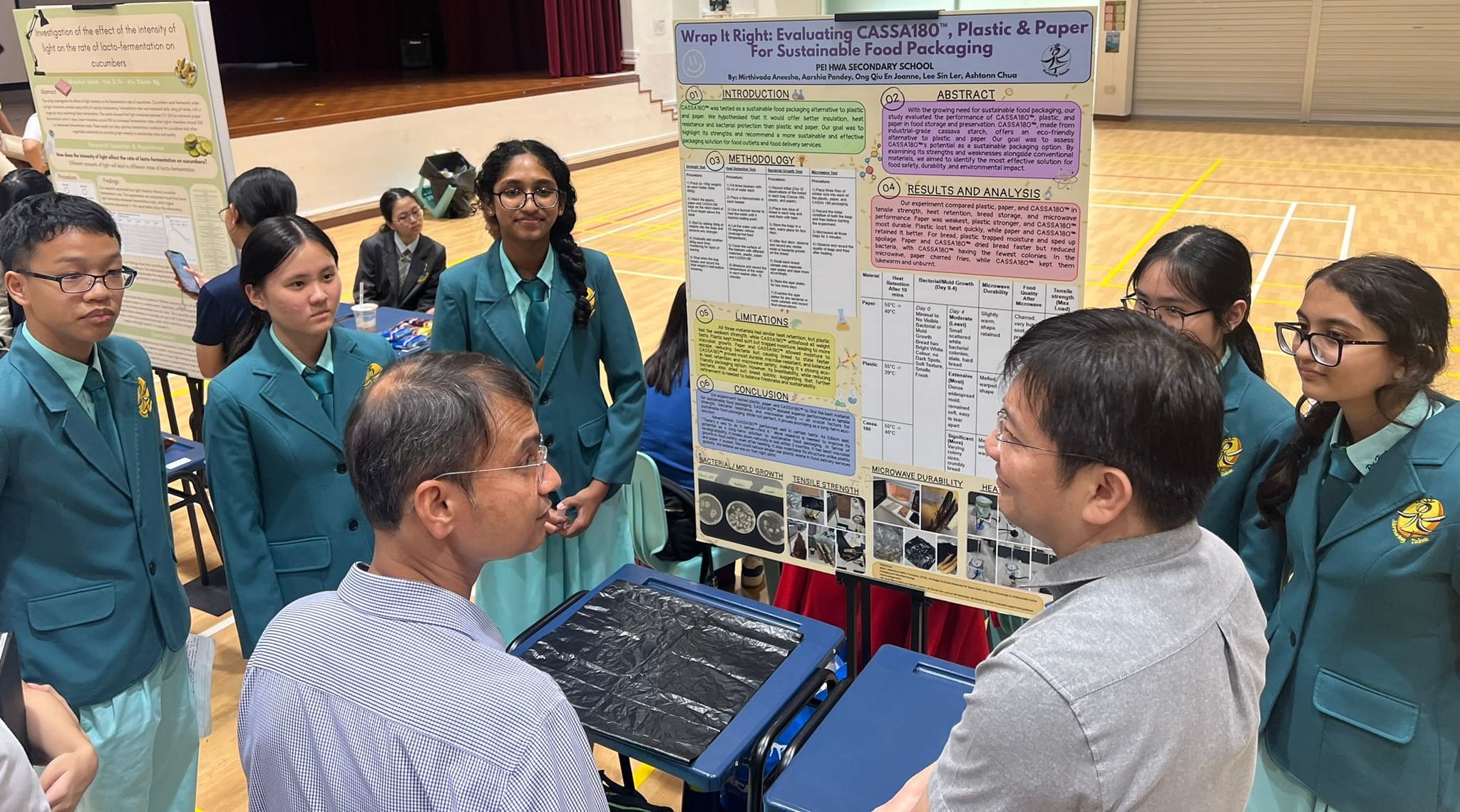 A group of students presenting their work to the judges